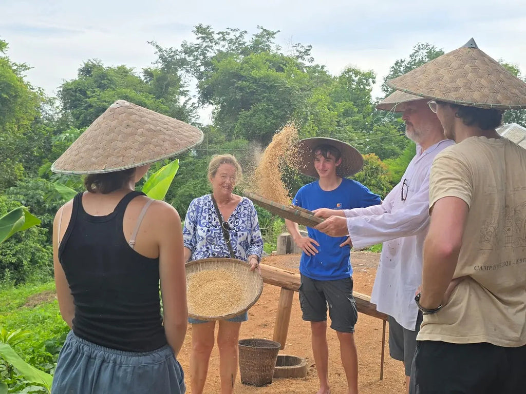 Khmu Traditional separating the rice husks